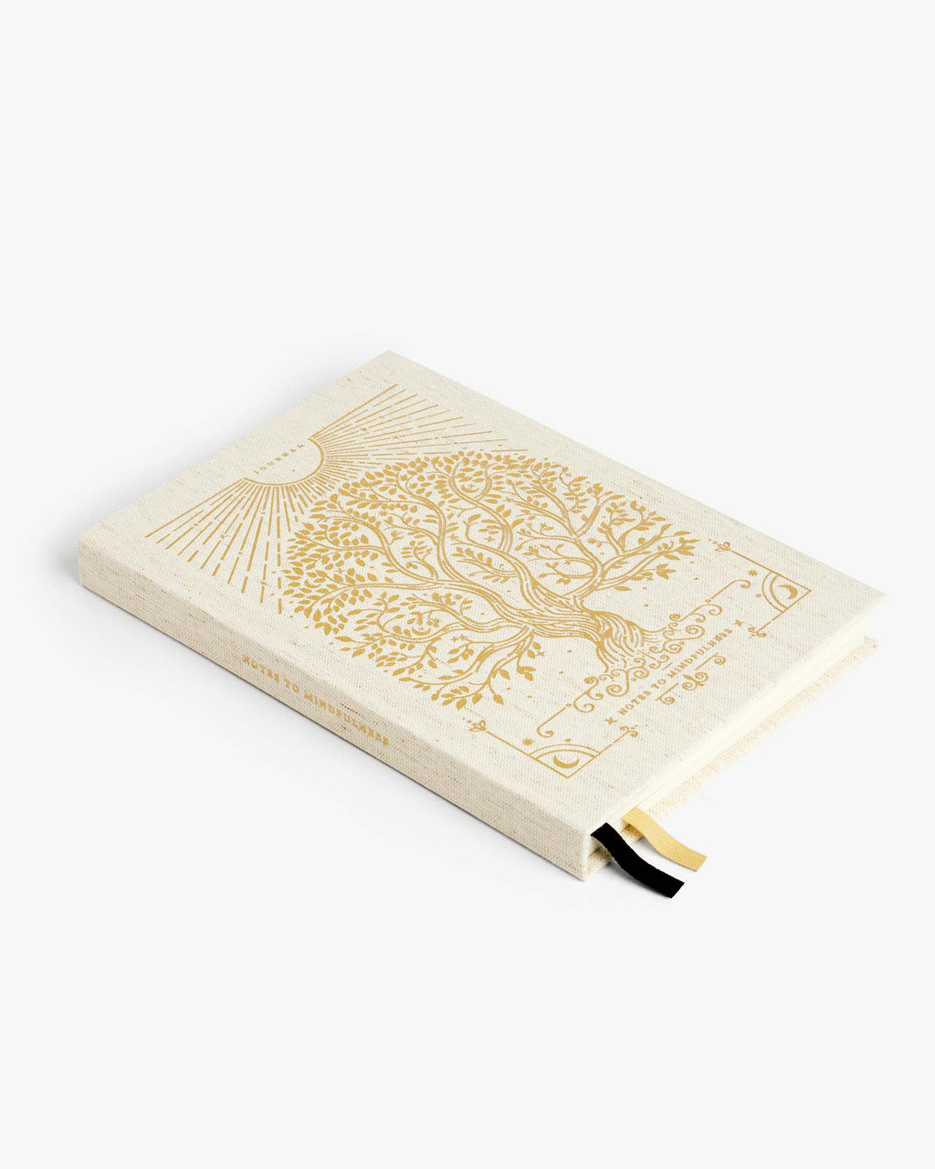 Closed linen mindfulness journal with gold tree-of-life illustration and black ribbon