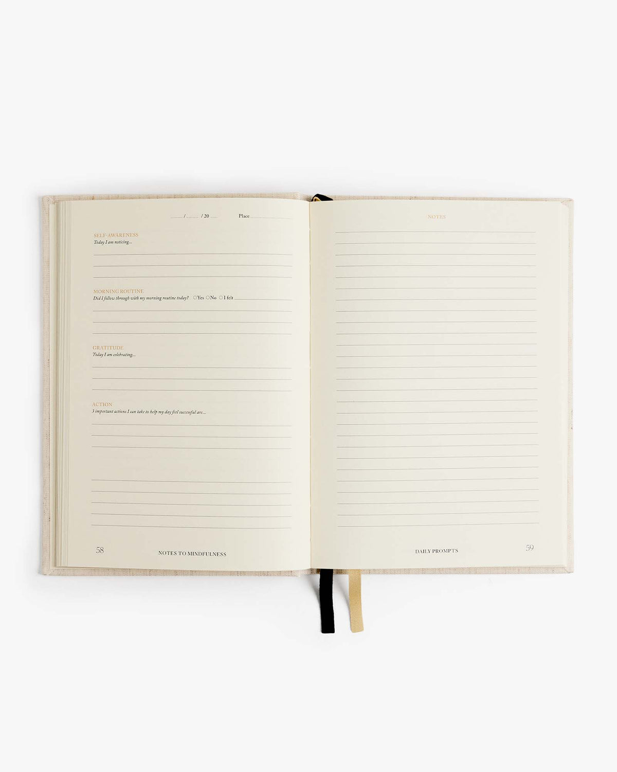 Open linen journal with lined note sections and black ribbon page marker