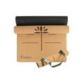 Cork yoga mat roll with natural cork color and dark carry strap