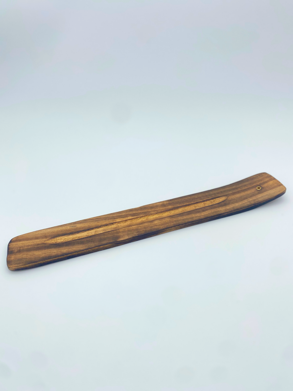 Wood incense holder plank with small ring hole at one end