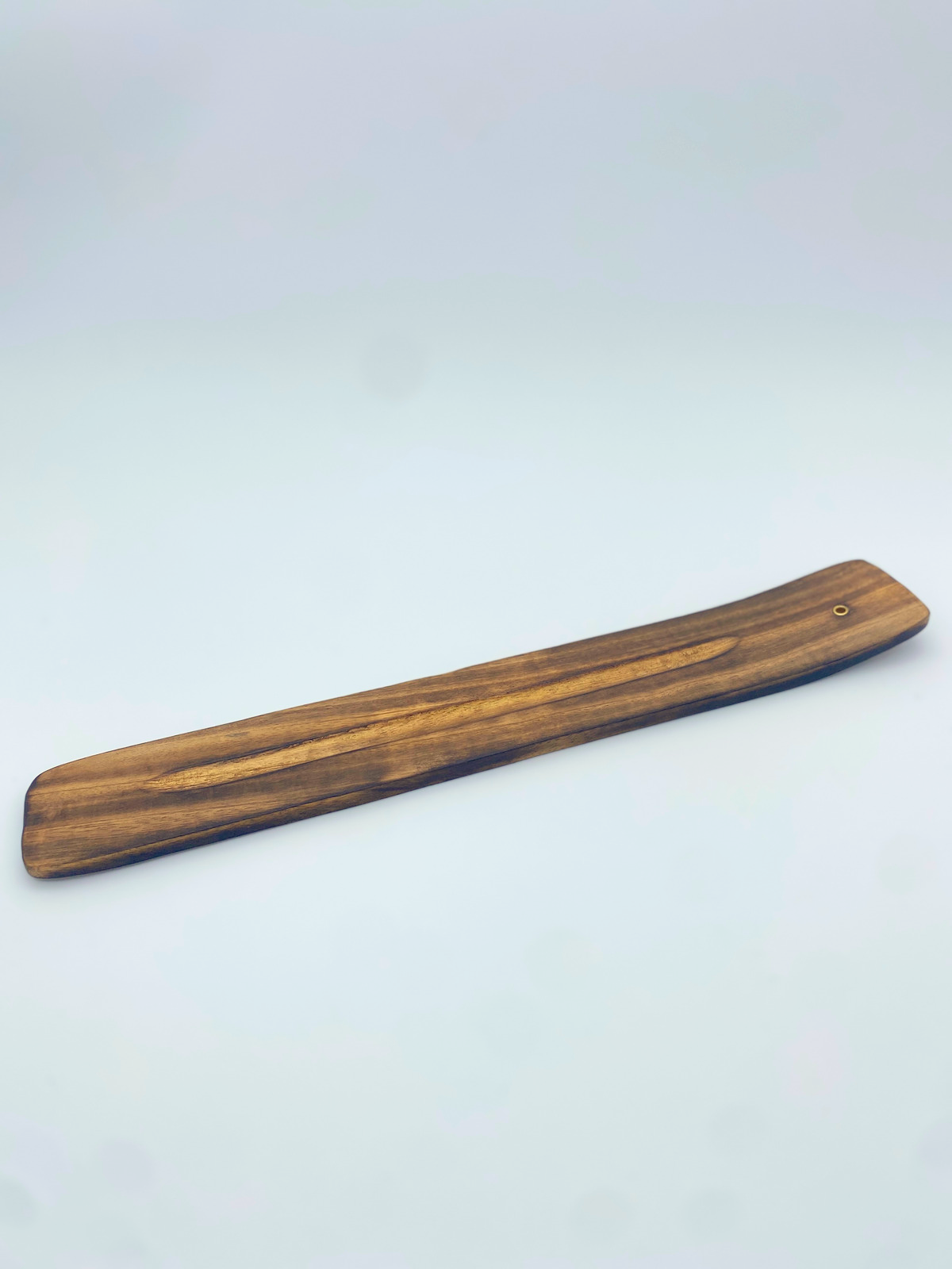 Wood incense holder plank with small ring hole at one end