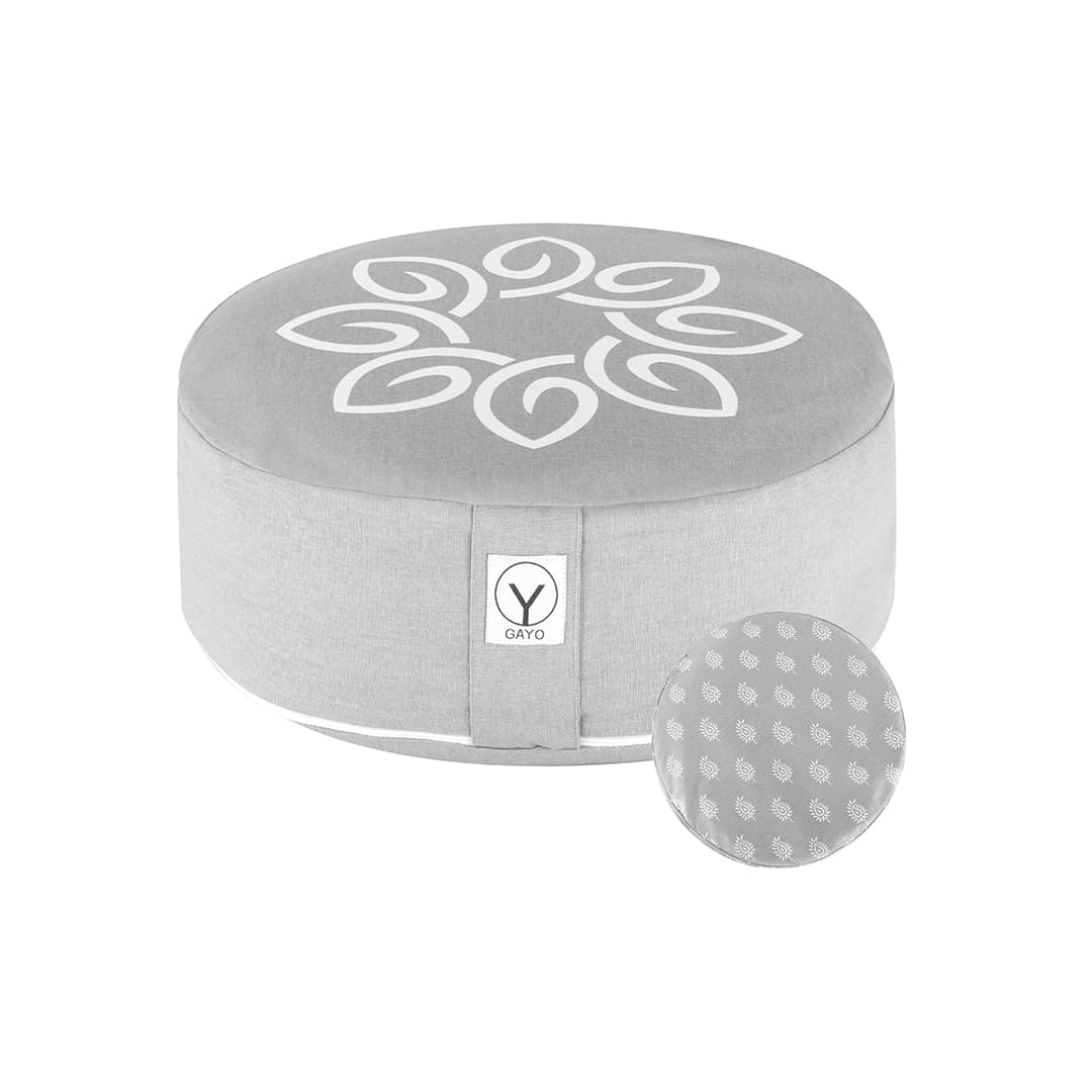 Gray round meditation cushion with white yoga-style emblem and central seam.