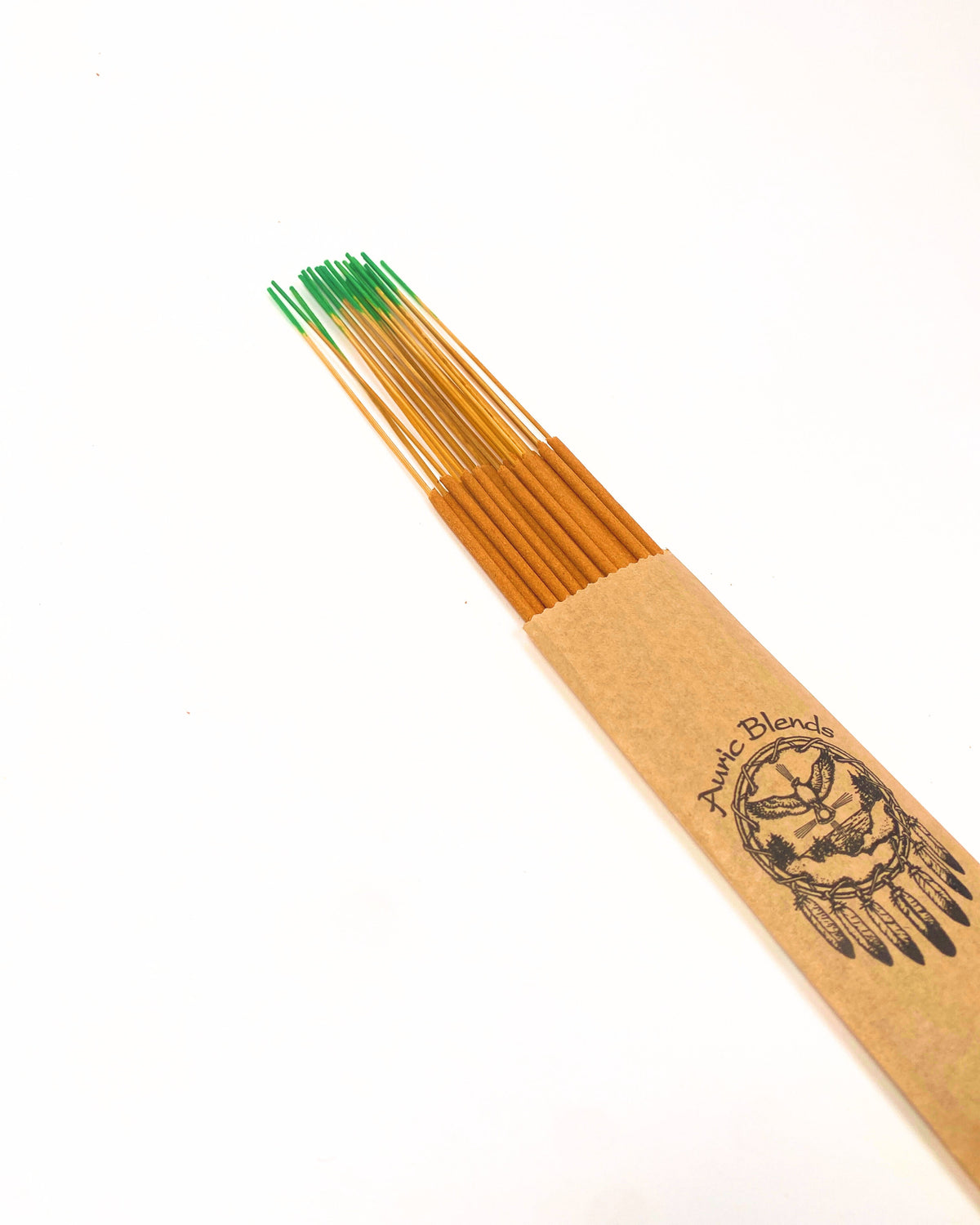 Incense stick with tan paper label and green-tipped end